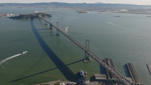 Aerial Slide and Pan Footage of San Francisco Oakland Bay Bridge at Rush Hour Busy Highway Bridge