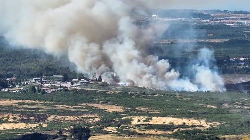 Aerial View Of Forest Fires In Chilean City Of Puerto Montt With Heavy Thick Smoke Rising Into Atmos