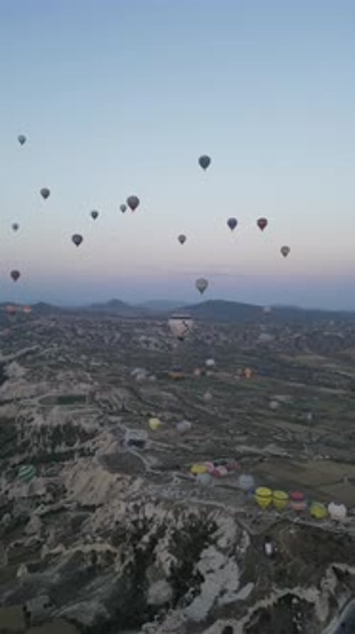 Aerial video over monoliths in Cappadocia, on hot air balloons, Turkey