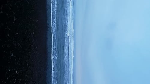 Vertical Video Drone Shot of Nordic Ocean Shore