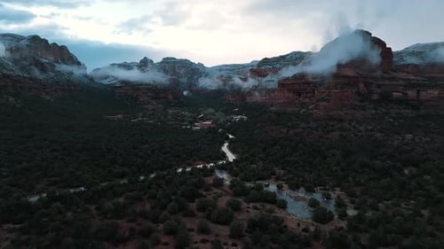 Foggy Clouds Over Red Rock Canyons In Sedona, Arizona. Aerial Wide Shot. Enchantment resort.