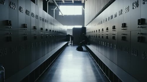 Modern Gym Locker Room with Empty Benches and Atmospheric Lighting