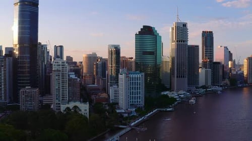 Cityscape Of Brisbane Near Brisbane River At Sunset In Queensland, Australia. - aerial drone shot