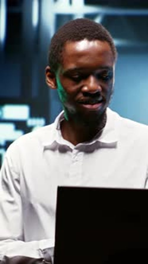 Young Adult Man Working on Laptop at Night