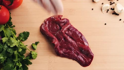 Raw Pork Liver is Cut in Half on a Wooden Cutting Board for Cooking It is Popularly Stirfried with