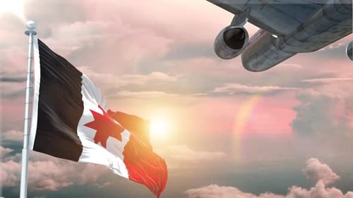 Waving Flag and Airplane Flying at Sunset