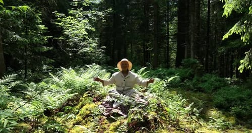 Young African Woman Doing Yoga Meditation in the Forest