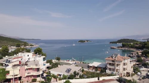 Aerial Establishing blissful blue water Riviera of Ksamil, Albania
