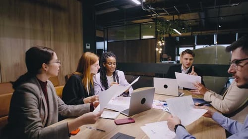 Engaging Business Meeting with Diverse Professionals Taking Place in a Modern and Innovative