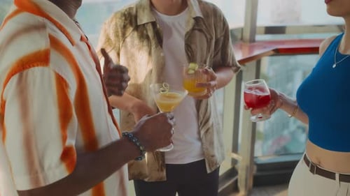 Unrecognizable People Spending Weekend at Bar with Cocktails