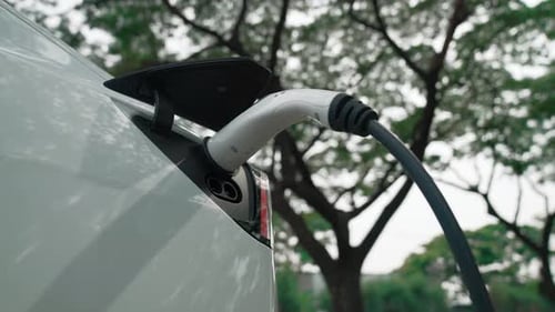 EV electric vehicle recharging battery in national park. Exalt