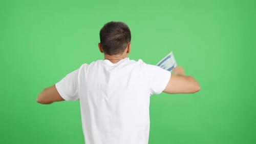 Rear View of a Man Waving a Israeli Pennant