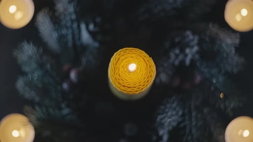 Extinguished Candle with Festive Evergreens and Candles