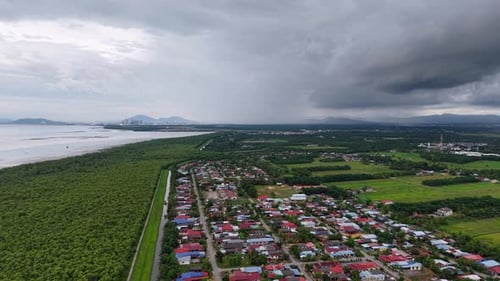 Aerial view of Sungai Chenaam village and mangrove coastline