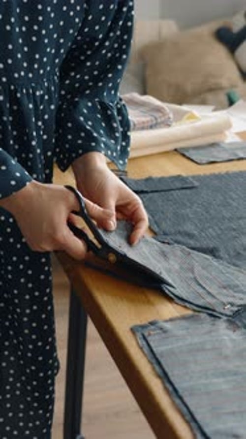 Tailor Cutting Fabric for a New Garment Design