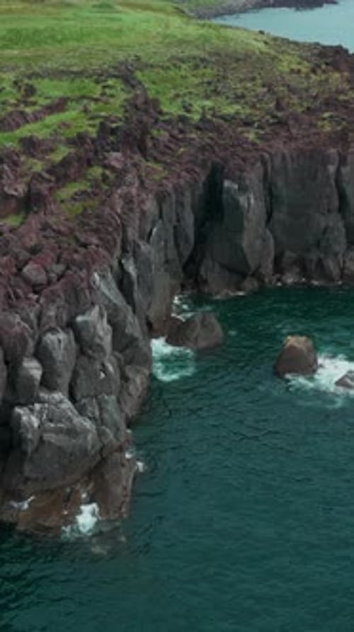 Cliffs and Landscape in Iceland Aerial View Clip Azure Sea and Steep Stone Slope of the Shore