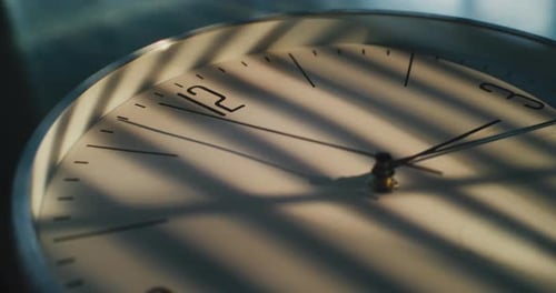 Close Up Shot of Minimalist Wall Clock with Dial and Running Hour Minute and Second Hands