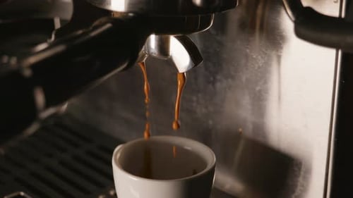 Espresso Machine Pours Coffee into a Mug