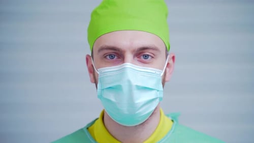 Medical Professional Wearing Mask and Surgical Scrubs