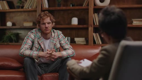 Young Man Talking in Counseling Session