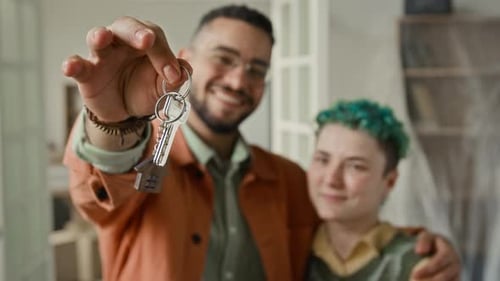 Smiling Couple Holding New House Keys