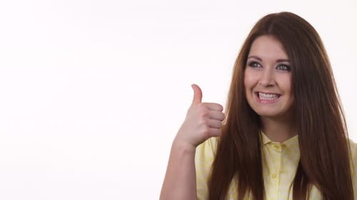 Woman Smiling and Giving a Thumbs Up