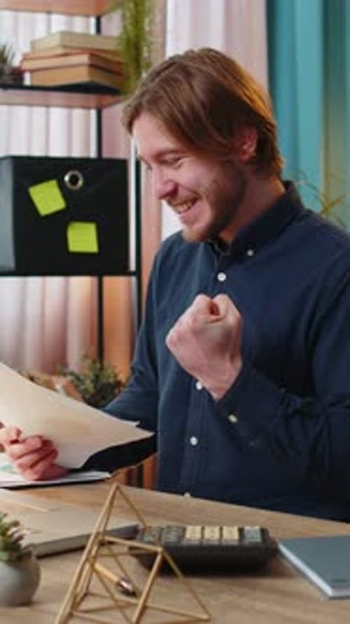 Focused Office Worker Man Working with Schedules Financial Graphics While Using Calculator Laptop