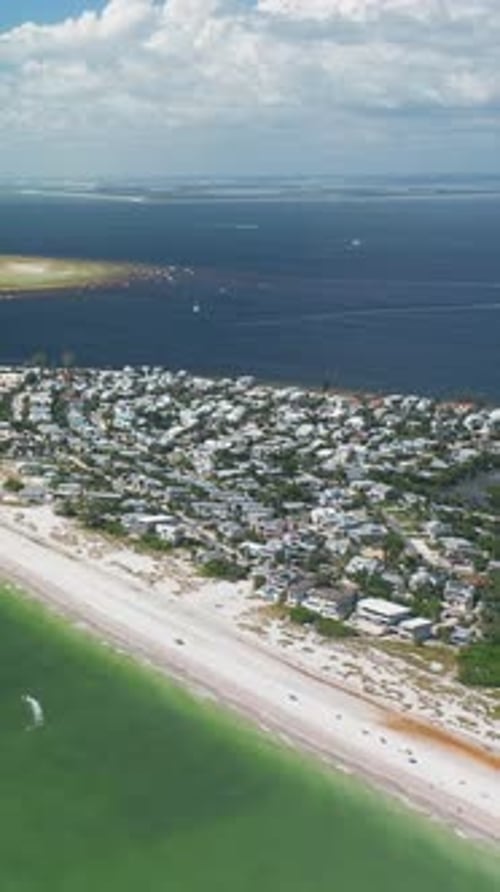 Aerial View of Coastal Town and Beachfront Property