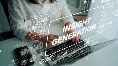 Woman typing on a laptop with digital graphics overlay