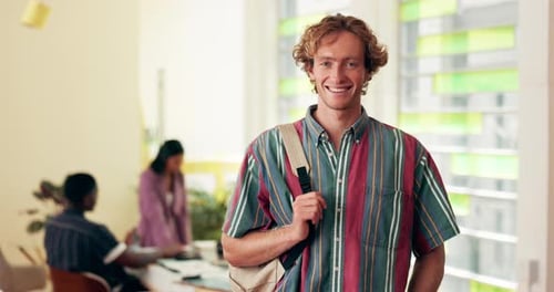 Man, happy and face of student with backpack in classroom at university with pride for scholarship