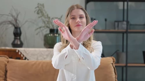 Young Woman Crossing Arms in Rejection Gesture