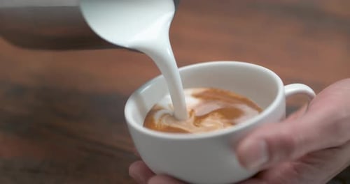 Milk Pouring Into Espresso For Latte Art
