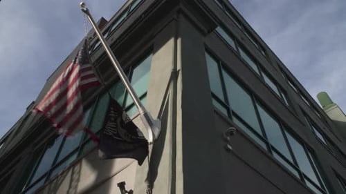 Flags on building, United States flag, city view