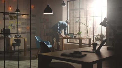 Creative Developer Works on Laptop in His Studio. Designing Apps and Social Media Design Structure