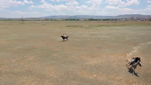 Horse And Man In Javelin Game With Aerial View
