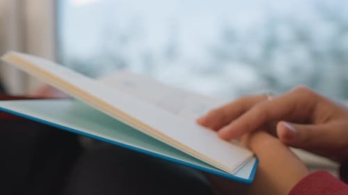 Calm Hands Turn Book Pages Fingers Gently Flipping Through Book Pages Tranquil Scene of Hands