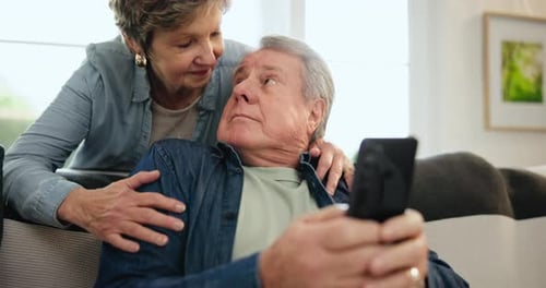 Loving Couple Taking Picture on Smartphone Indoors