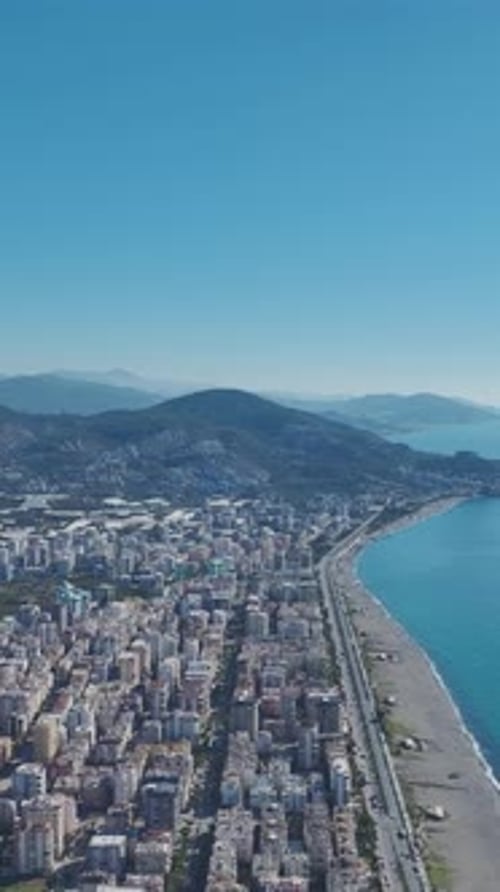 Vertical Video Stormy Mediterranean Sea With White Foam and Crashing Waves Captured Vertically in