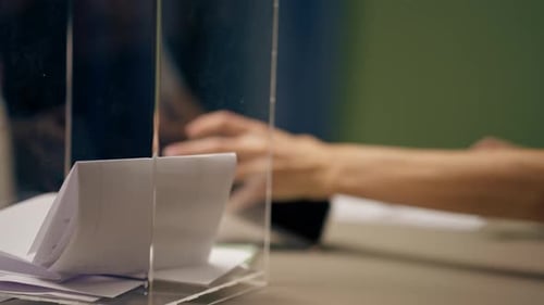 Close Up In the Selection Committee of the Election Company a Guy Registers to Vote a Young Girl