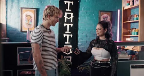 Phone, pos machine and payment with people in tattoo parlor or store for online banking