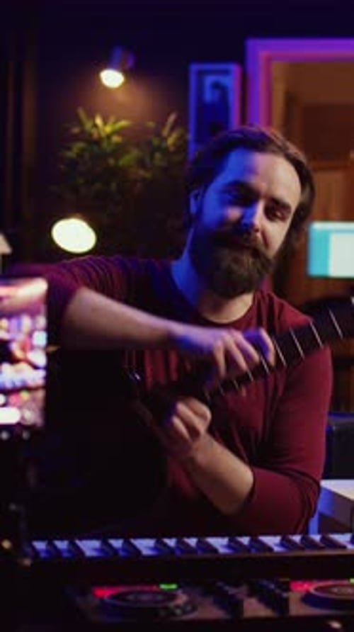 Musician Plays Keyboard and Guitar in Dark Room