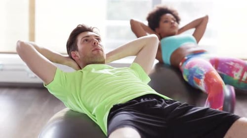 Fitness, Sport, Training and Lifestyle Concept - Group of People Flexing Abdominal