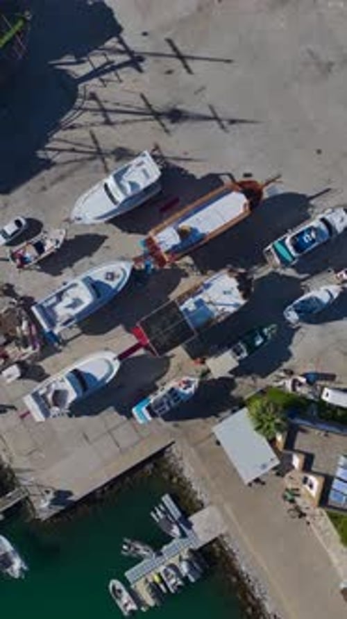 Vertical Video of a Port in Alanya With Rows of White Yachts and a Scenic Coastal Horizon Seen From