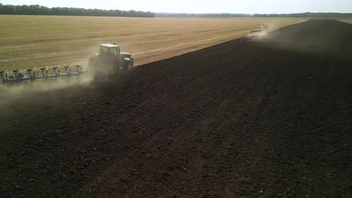 Tractors plowing the field in Ukraine