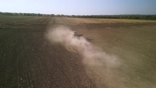 Tractor on the field seeding wheat