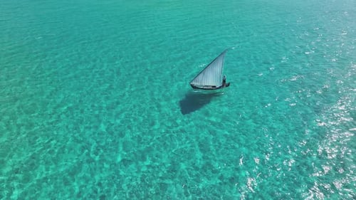 Aerial view of sailboat in turquoise water, Maldives.