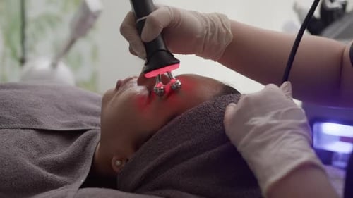 Woman Receiving Facial Treatment in Medical Spa
