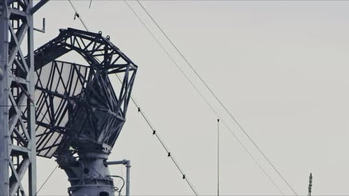 Rotating Radar Dish Antenna on Building