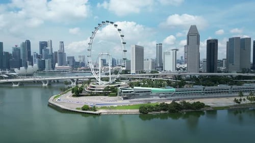 Drone shot of Marina Promenade and Singapore Flyer Eye, wide orbit of Formula 1 One Paddock Area. Si