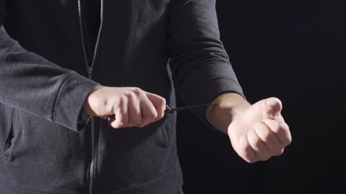 Aggressive punk man holding knife and making dangerous moves.